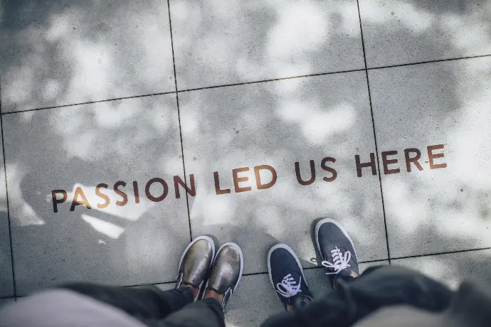 two person standing on gray tile paving